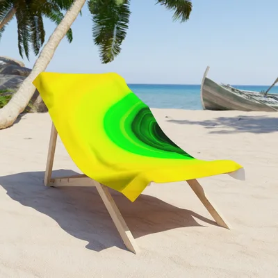 Circular light artwork by the ArtDrop founder on a real beach towel