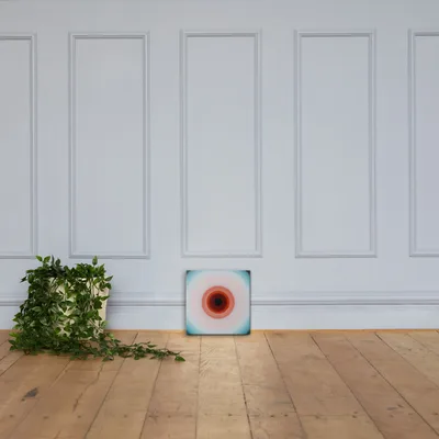 Circular light artwork by the ArtDrop founder on a real gallery canvas